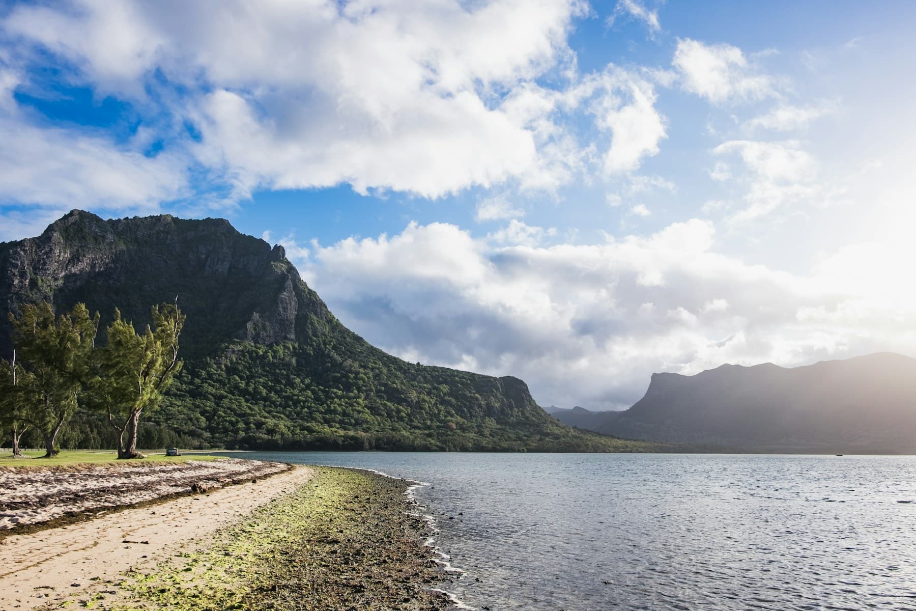 Le Morne kite beach with lagoon water, trees and mountain backdrop