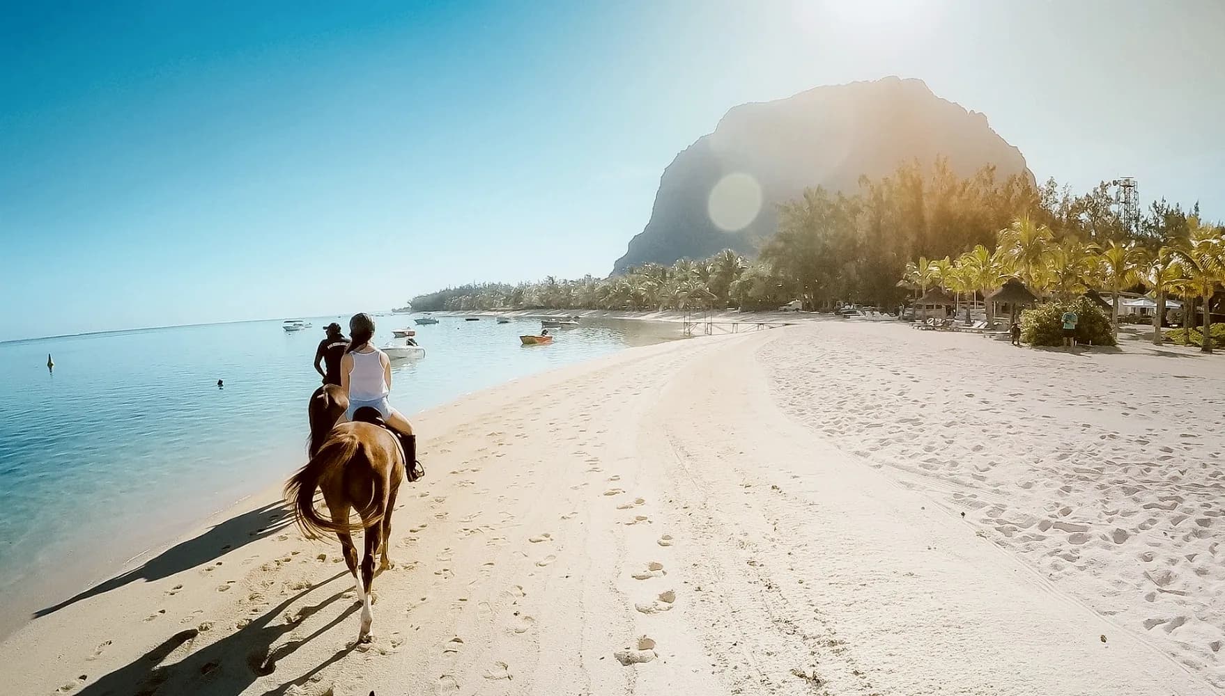Riding the beach at Le Morne with the mountain behind